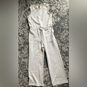 Girls size 12 cream color jumpsuit.